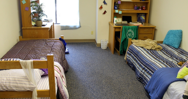 Image of standard dorm room at AJU featuring two beds and two desks