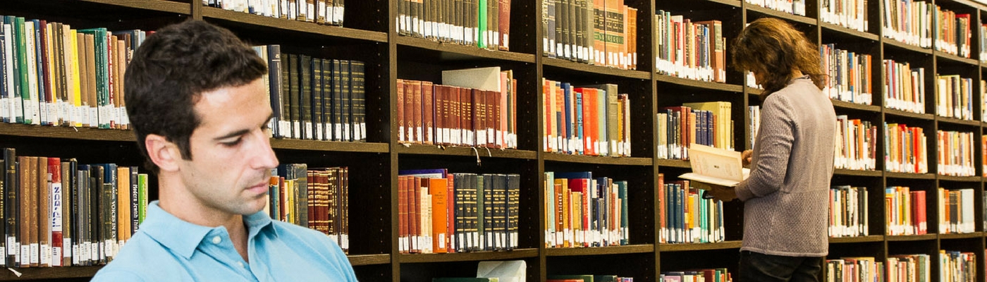 Image of two students studying in library