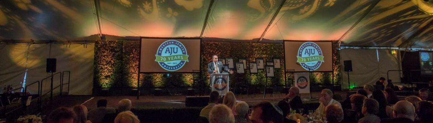 Photo of Dr. Robert Wexler speaking at AJU's 70th Anniversary dinner