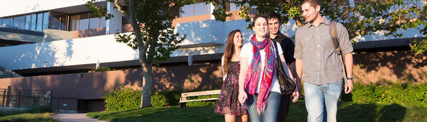 Photograph of students walking through campus