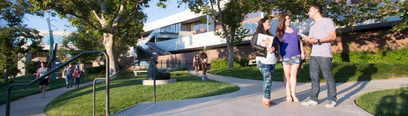 Photograph of students walking in sculpture garden