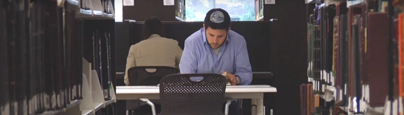 Photo of student studying in library