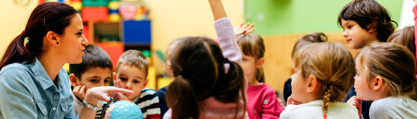 Photo of teacher with School children