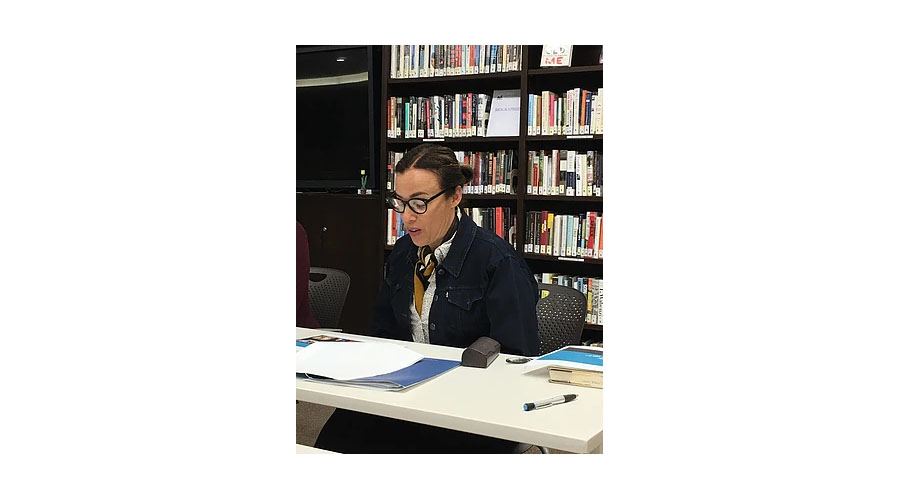 Photo of woman at desk in library