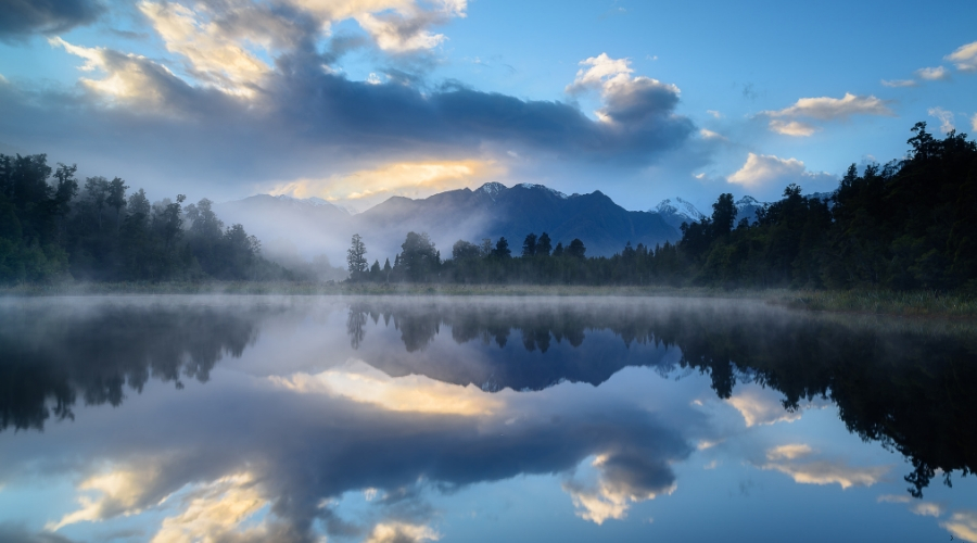 Photo of Mountains reflected in a lake