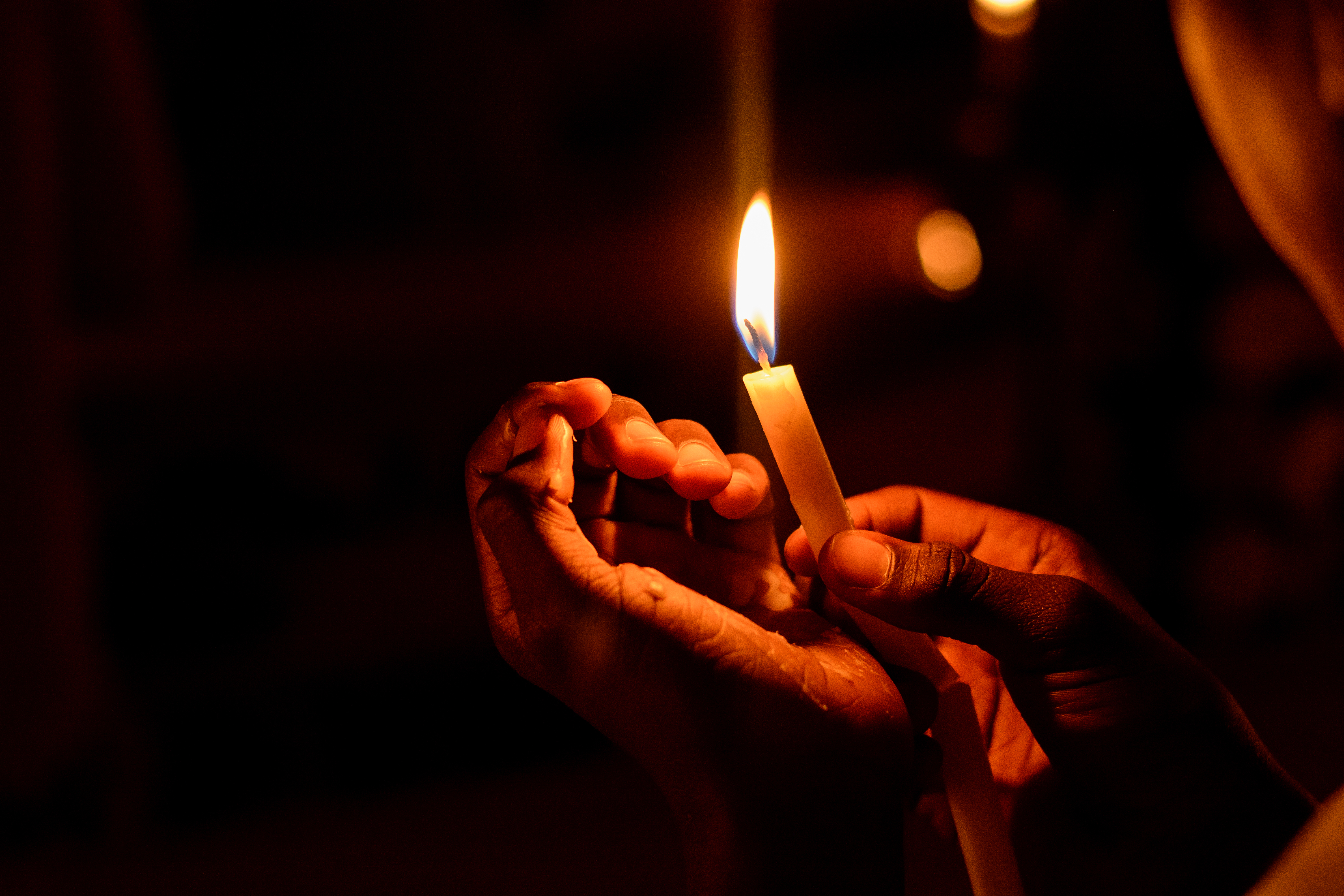 Person holding candle