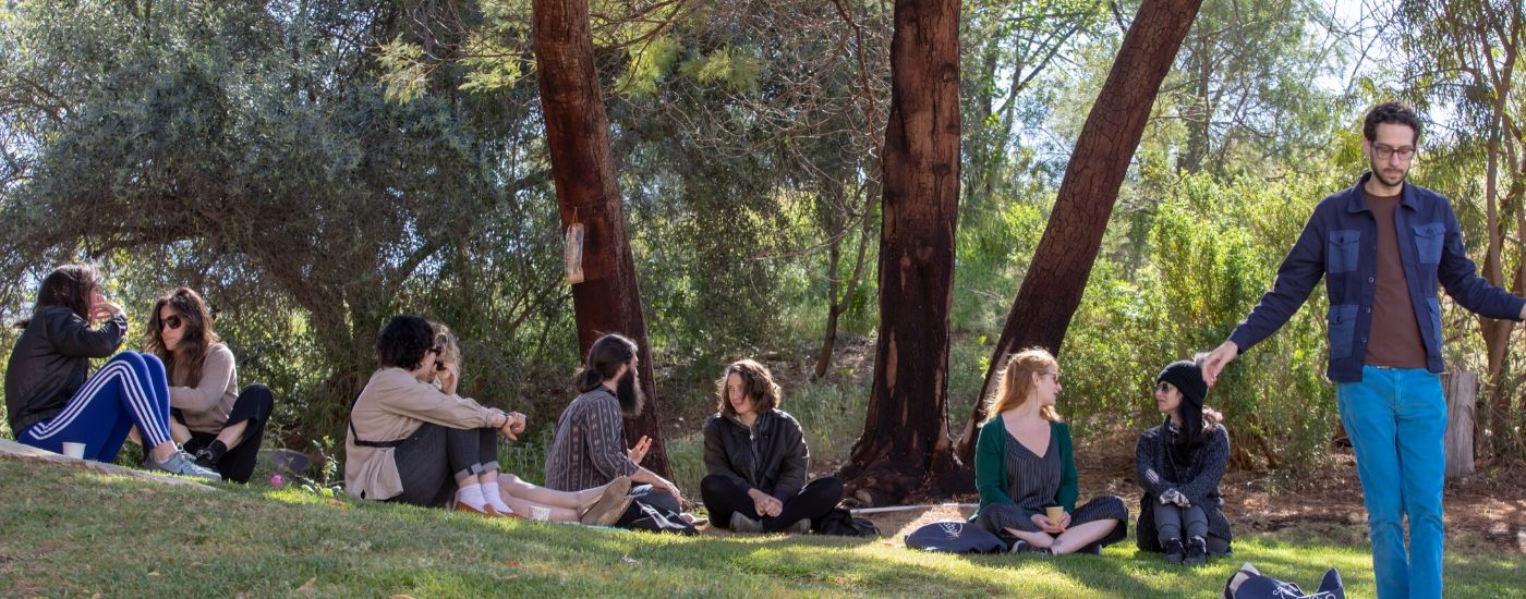 Photo of people sitting on grass