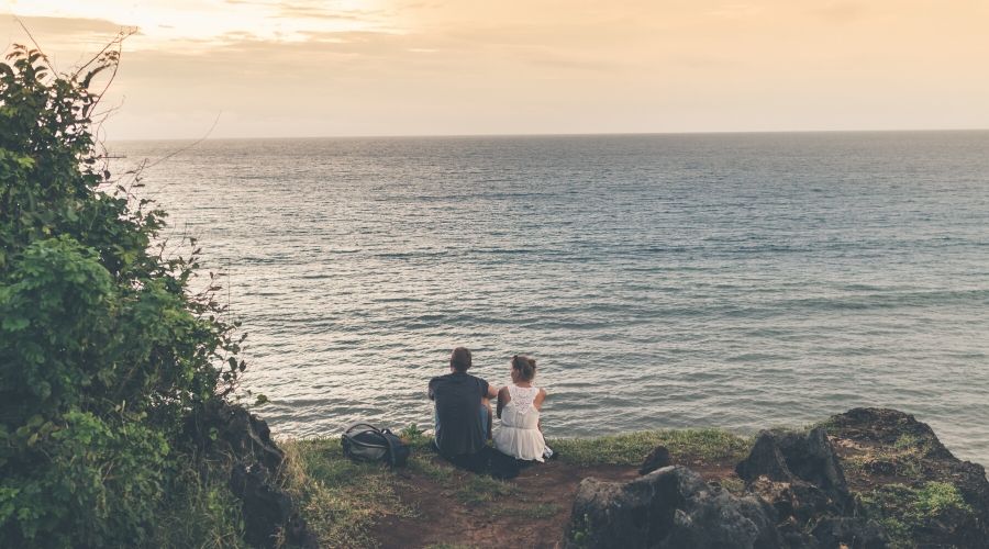 Photo of Couple Sitting on Beach