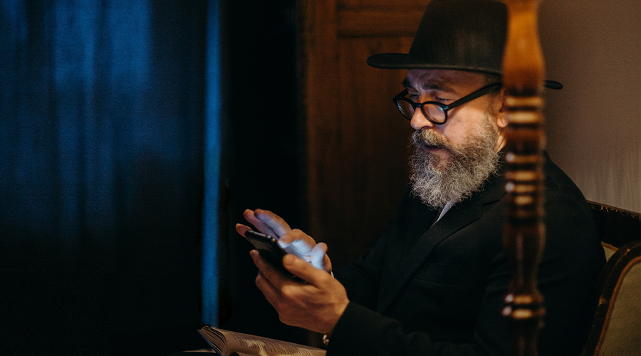 rabbi texting on a cell phone