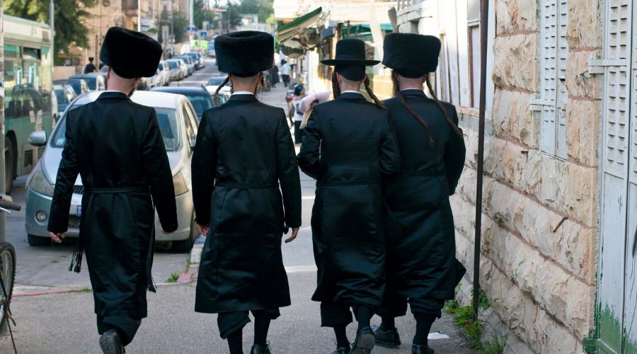 hassidic men walking down the street