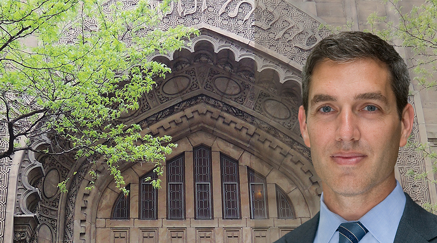 rabbi cosgrove standing in front of a synagogue