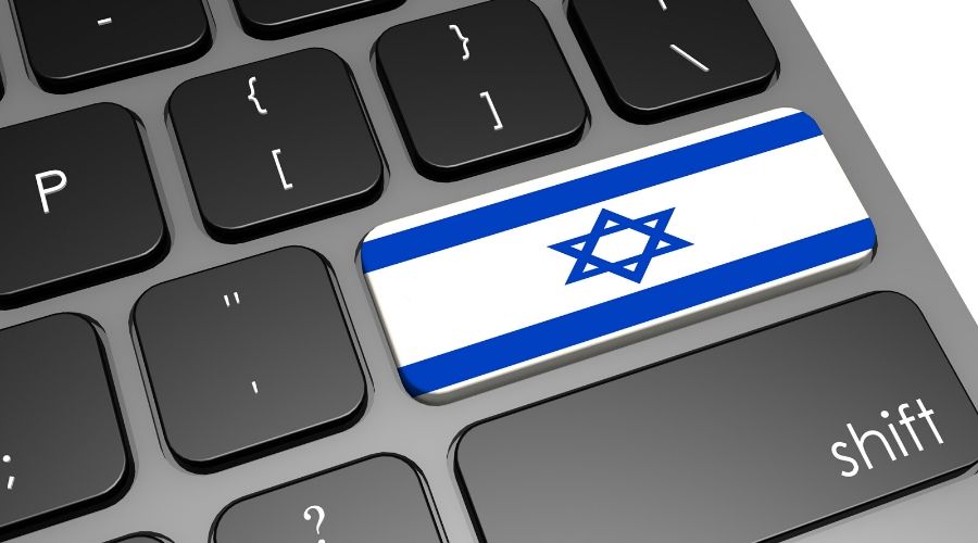 laptop keyboard with the flag of israel on it