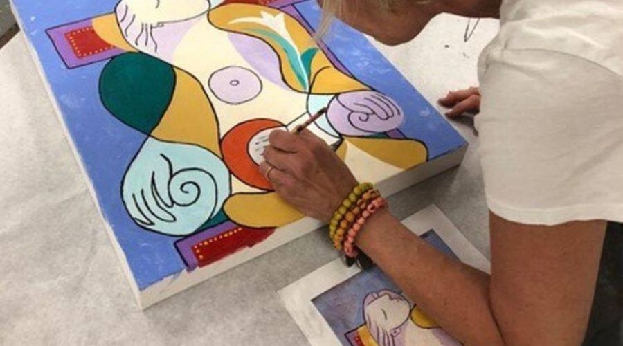 woman painting in a studio