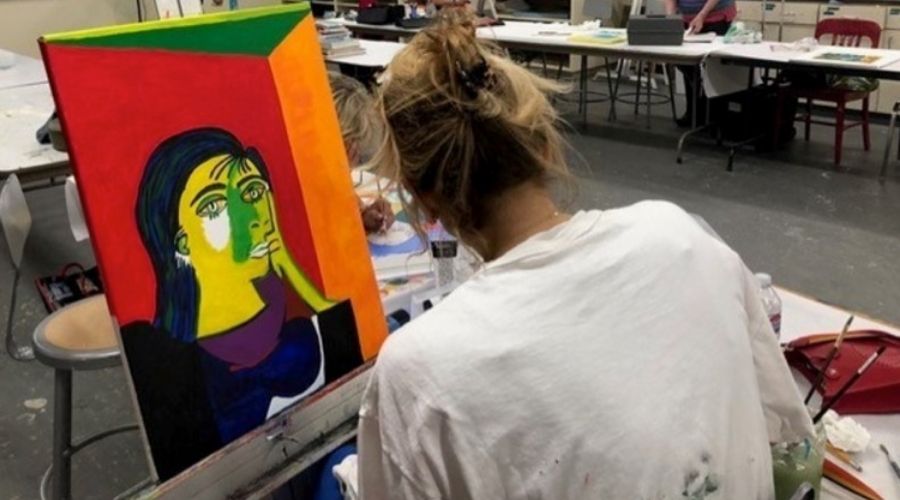 girl painting in a studio