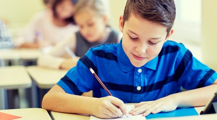 Photo of boy taking a test at school