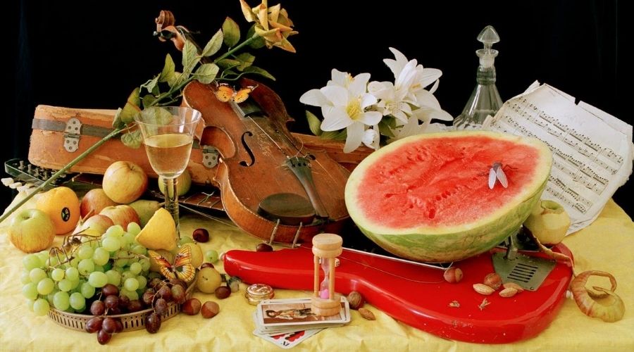 still life with fruit and a guitar