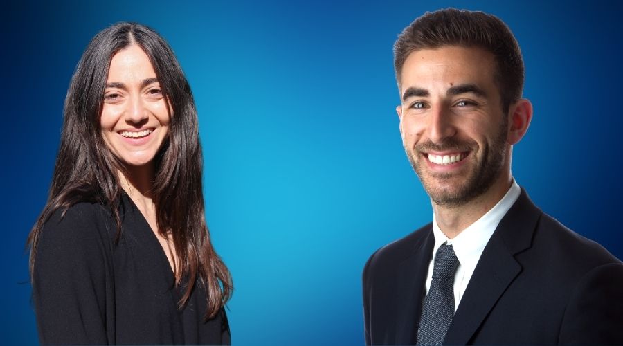 speakers in front of a blue background