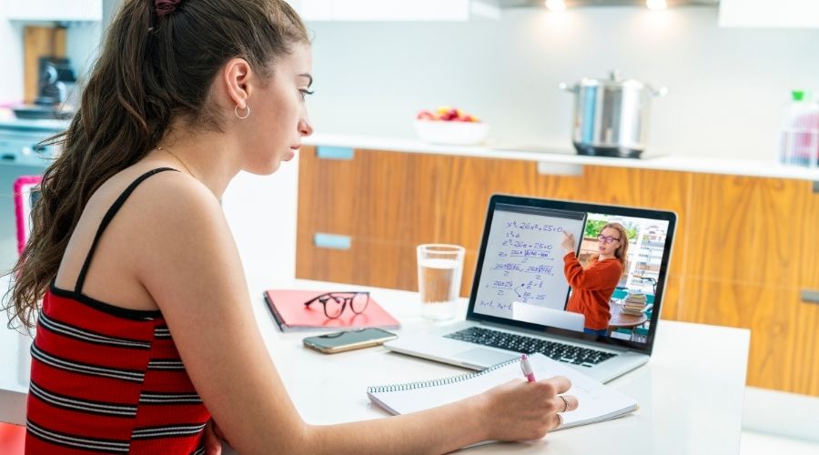 a girl studying on a computer