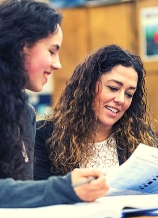 two students looking at a paper