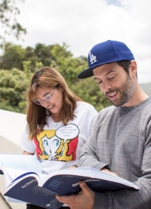 Man and Woman Reading Text Book