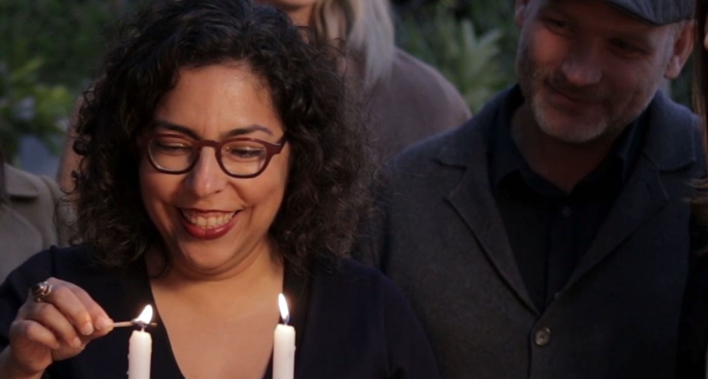 woman lighting candle