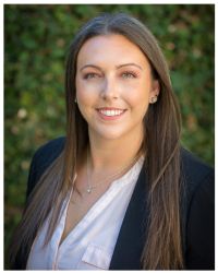 Headshot of Alyssa Silva in white shirt with black blazer