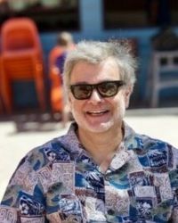 Headshot of Paul Schneider in sunglasses