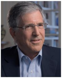 Headshot of Rick Richman in glasses, blue collared shirt, and black jacket