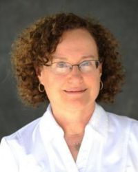 Rabbi Patricia Fenton in white collared shirt