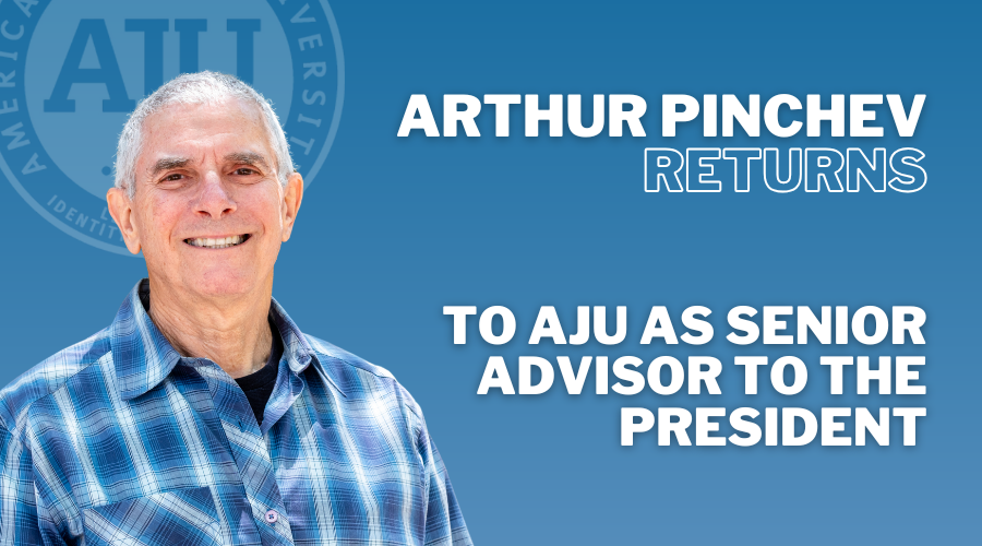 Arthur Pinchev headshot blue checkered shirt blue background