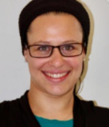 Headshot of Dana Keil in black glasses